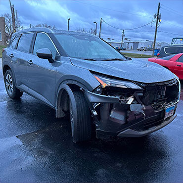 Nissan Suv before collision repair with damaged front bumper