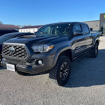 Charcoal gray Toyota truck after collision repair