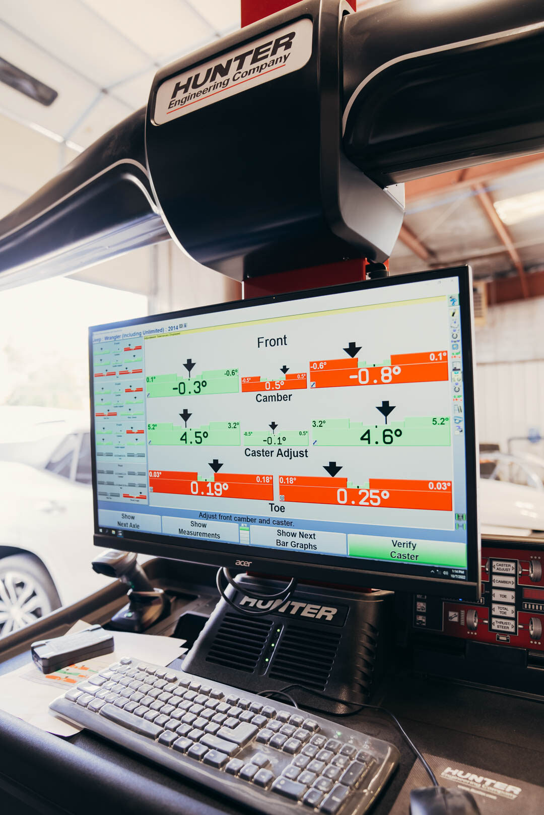 Computer showing auto calibration inside of Lander's garage