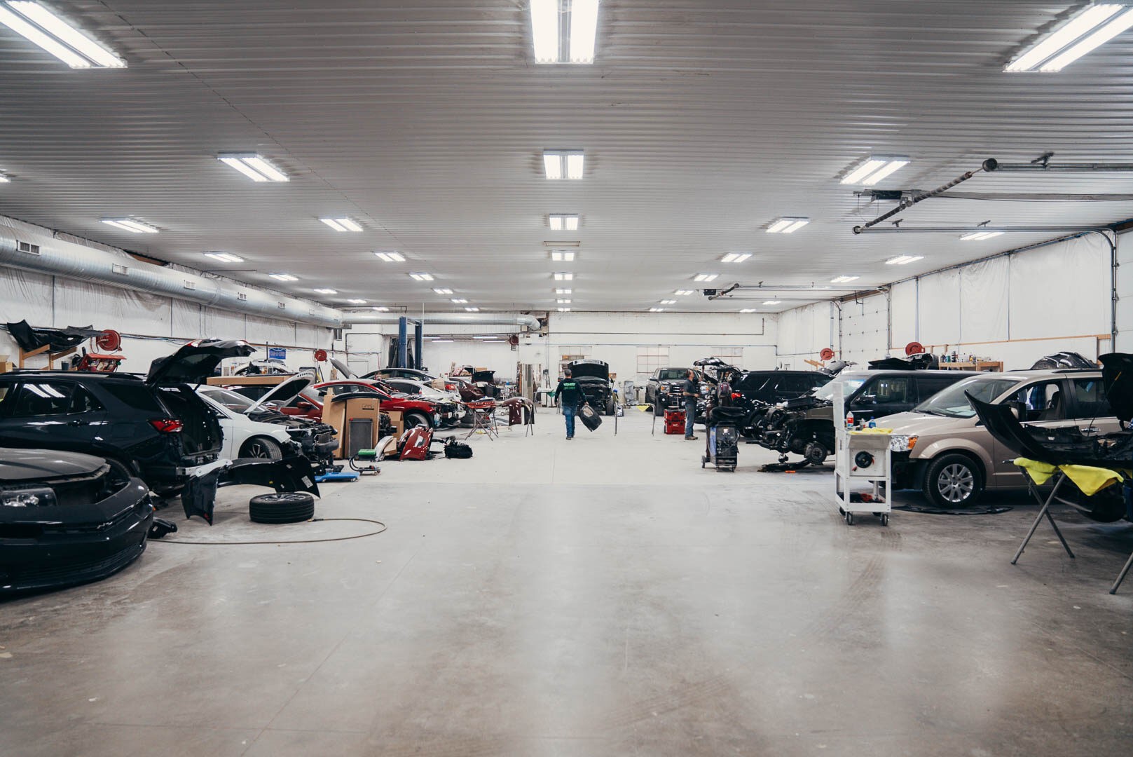 Wide shot of Lander's Automotive garage filled with vehicles getting worked on