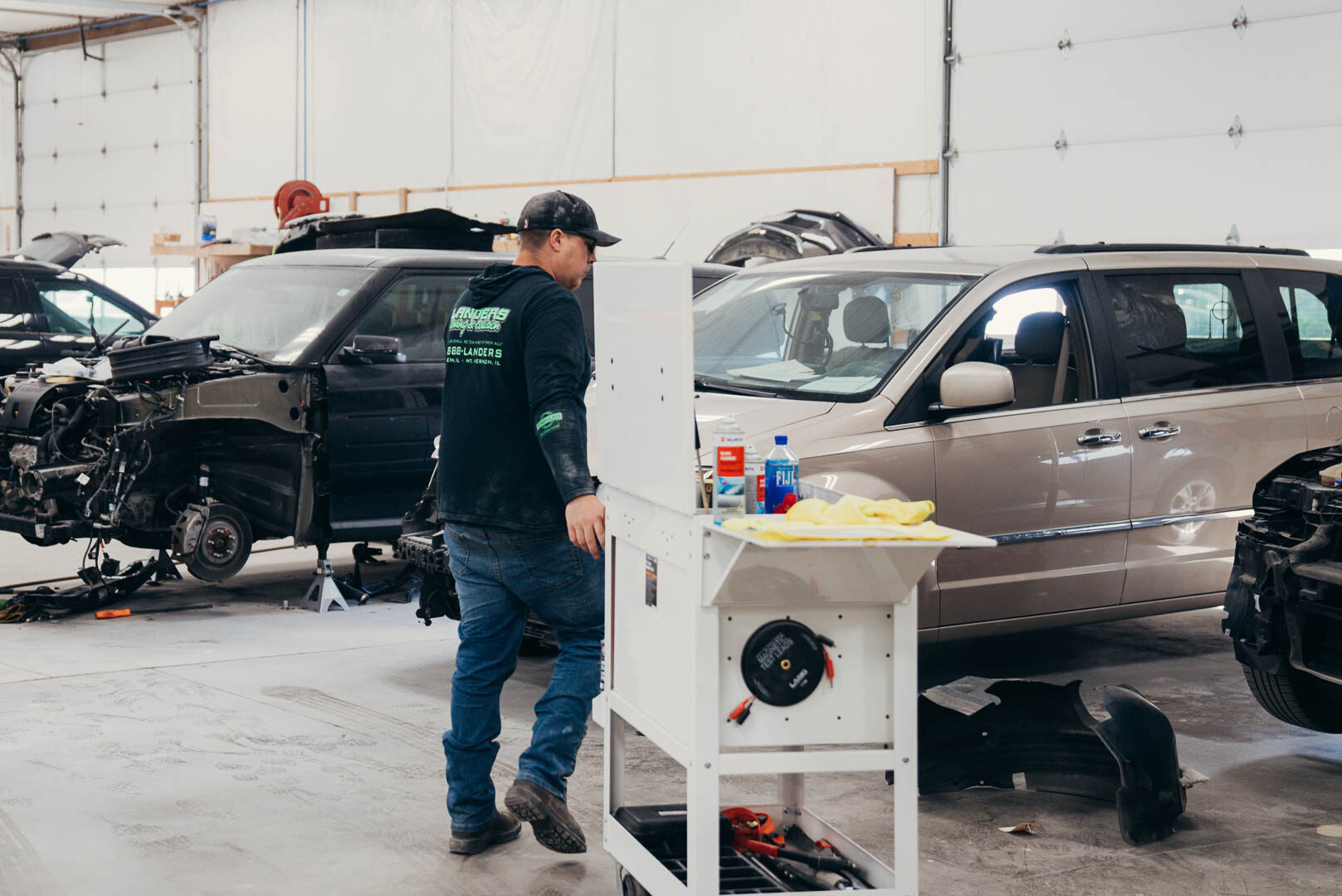 Lander's automotive employee in action inside of garage