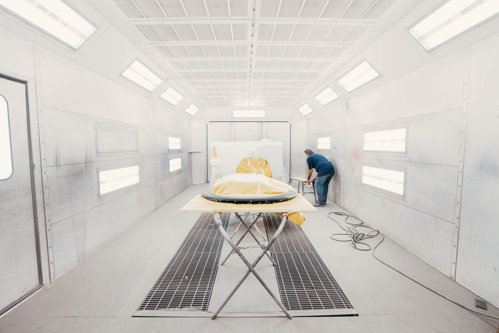Lander's automotive employee preparing a painting booth