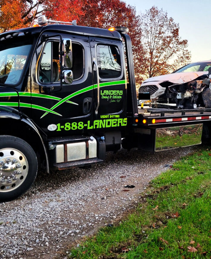 Landers towing and Collision tow truck in the fall